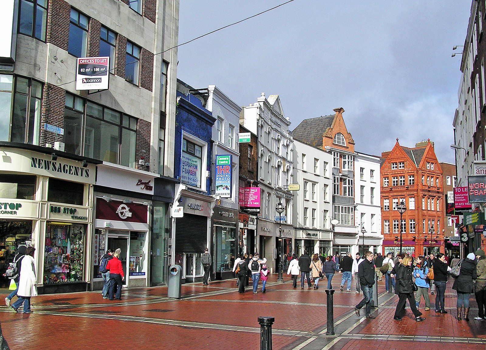 Grafton Street in Dublin lined with shops and pedestrians