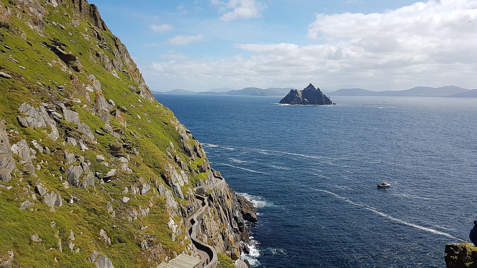 Little Skellig and a boat seen from the path on Skellig Michael