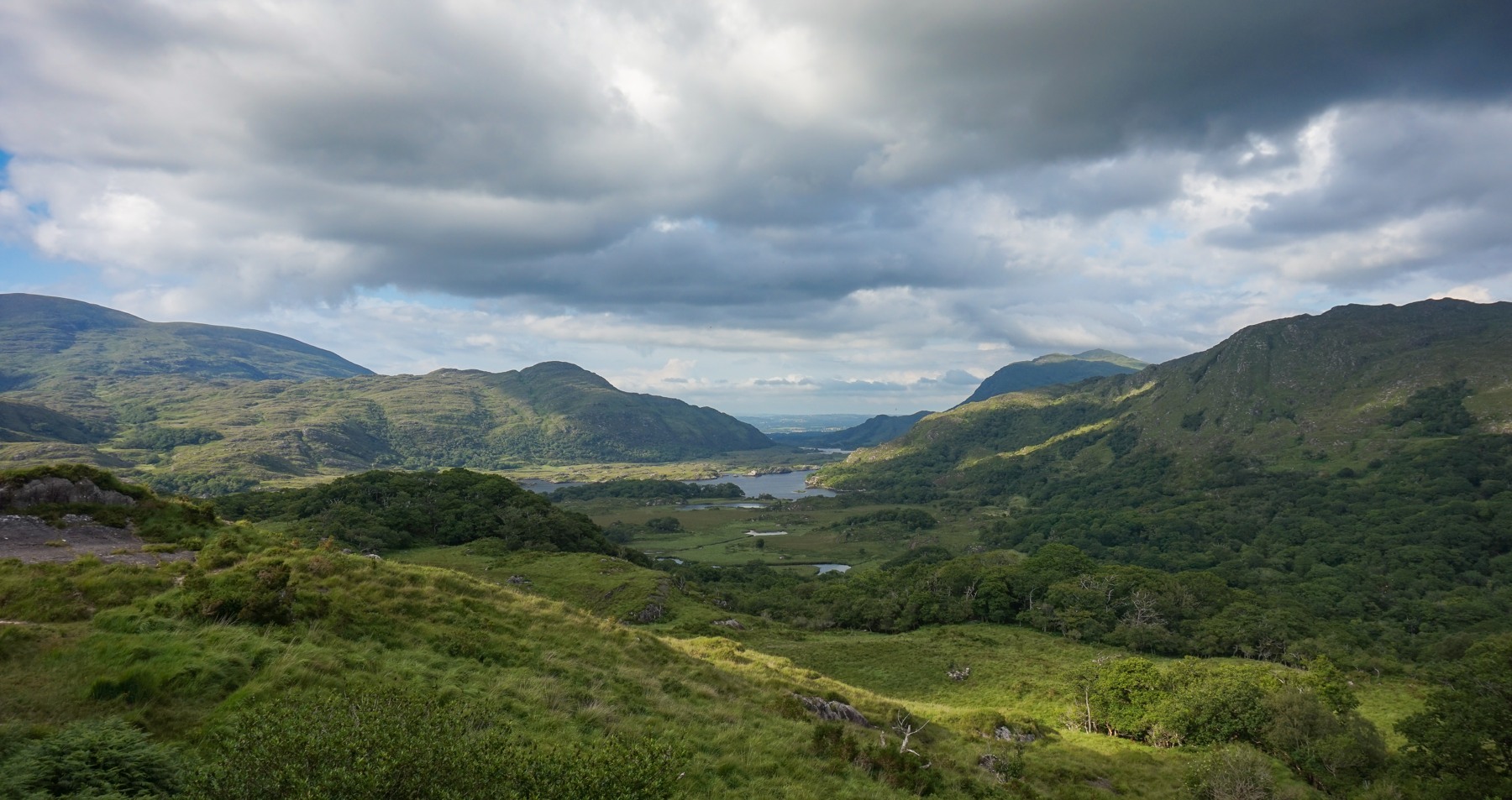 Lakes and wooded valleys seen from Ladies View under broken cloud