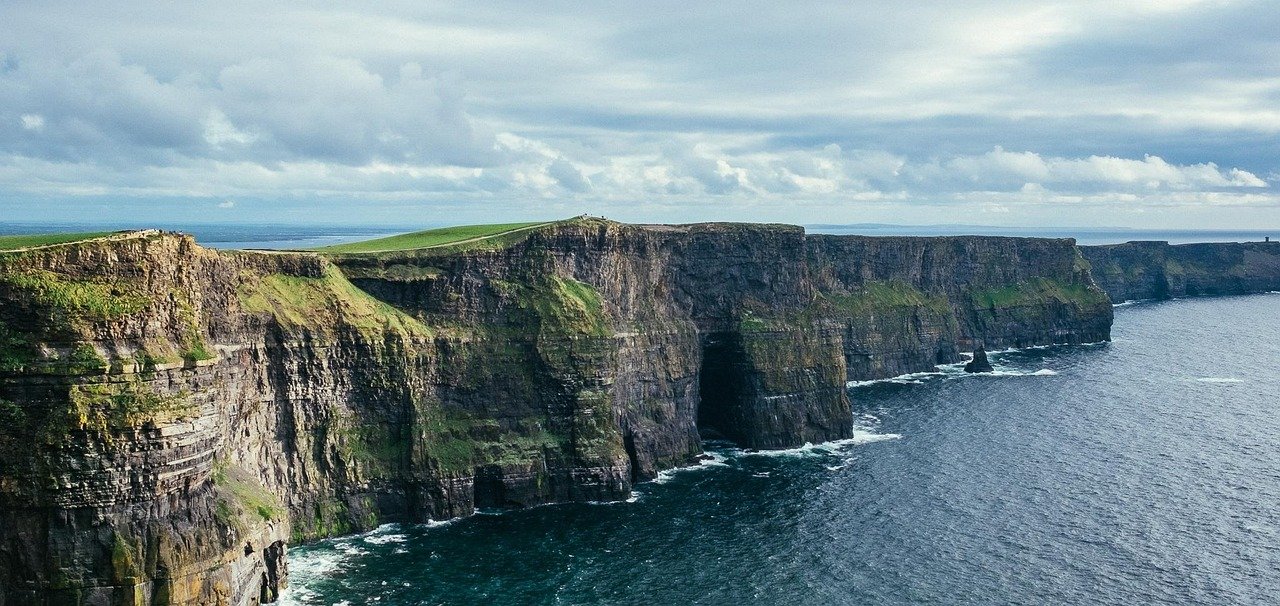 The Cliffs of Moher under heavy grey clouds in winter