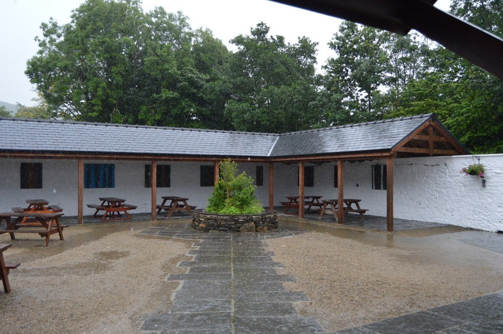 Covered picnic tables in the Connemara National Park visitor center courtyard