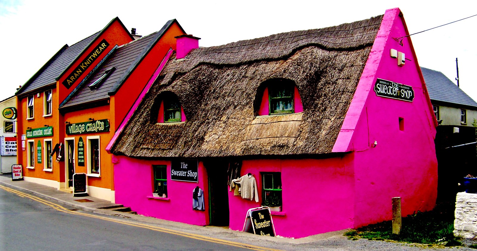 Pink thatched shop and neighboring cottages in Doolin