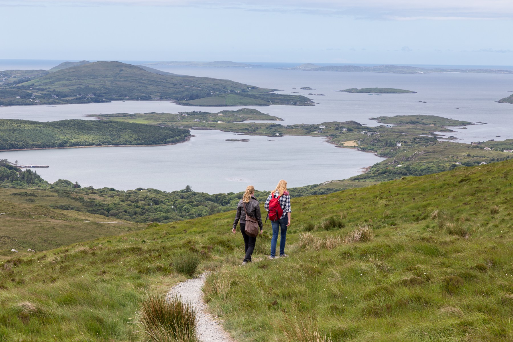 Hikers on Diamond Hill looking toward the Connemara coast