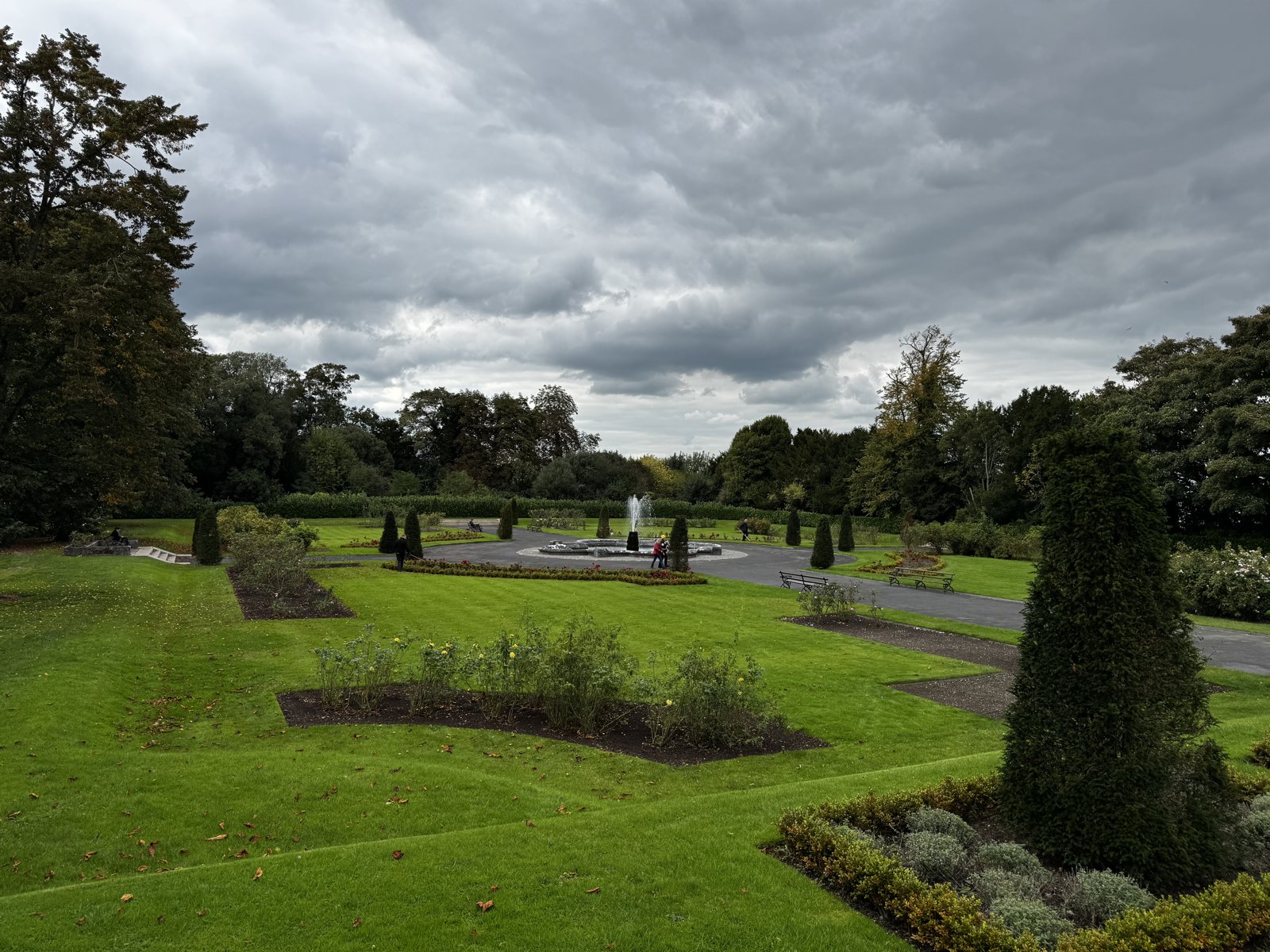 Fountain and clipped trees in the castle gardens