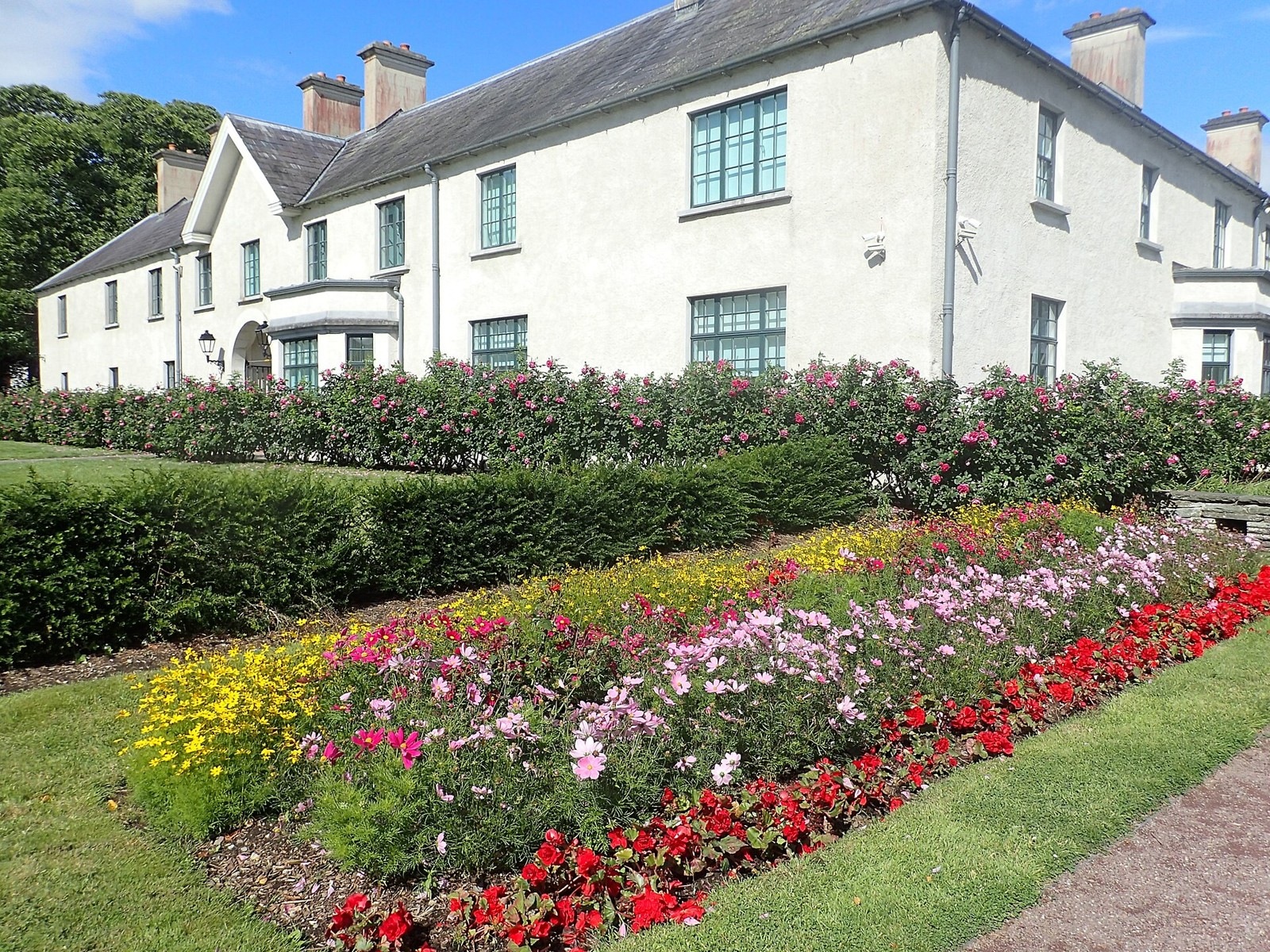 Killarney House beside its formal flower beds